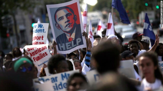 Low-wage workers employed under federal contracts call for higher wages September 25 in Washington.