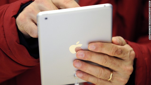 A man uses a iPad Mini, which was released by Apple on November 2, 2012. Here's a look back at the history of the iPad, the tablet computer that Apple first introduced in 2010.