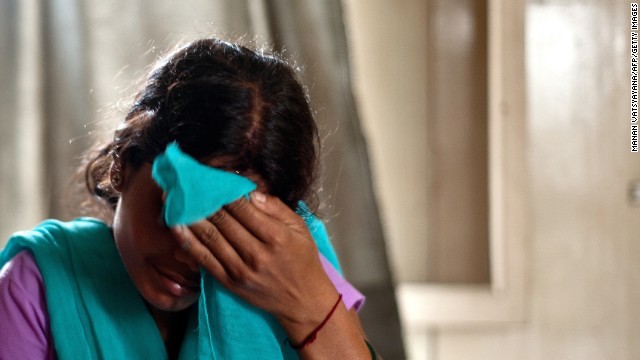 A trafficking victim sits at a police station on September 16 after being rescued from an Indian village near New Delhi. 