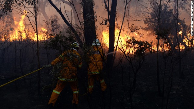 Firefighters battle flames in the Blue Mountains on October 24.