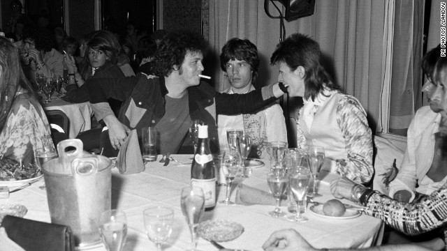 Reed, Mick Jagger, center, and David Bowie, right, share a joke at a party at Cafe Royal thrown by Bowie on July 3, 1973.