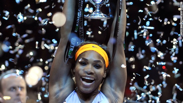A relieved Serena Williams lifts the WTA Championship title aloft after beating Li Na in a three set final.
