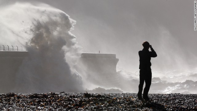 Large waves break against the harbor wall in Dover, England, on Monday.
