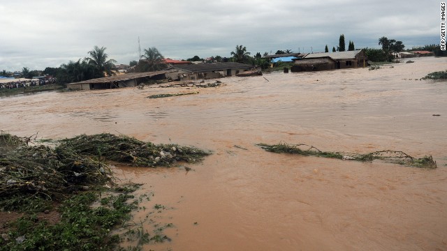 Floodwaters course through Odo Ona in Nigeria's Oyo State in 2011. At least 102 people were killed when a dam burst during torrential rain.