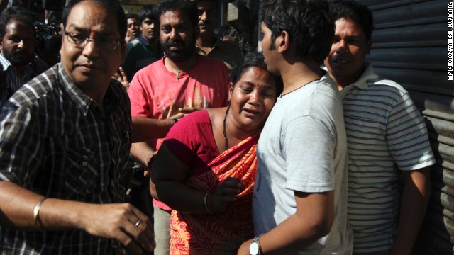 Relatives of passengers on board a crashed bus gather outside the offices of a the bus operator, Hyderabad, Oct. 30, 2013.