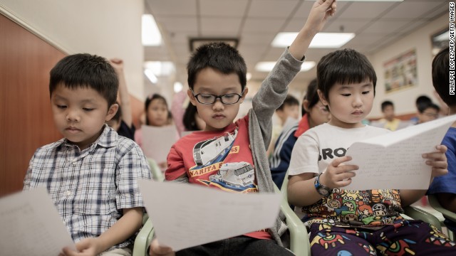 Children learn how to speak English with an American accent at the Nature EQ school in Hong Kong on Sept. 29.