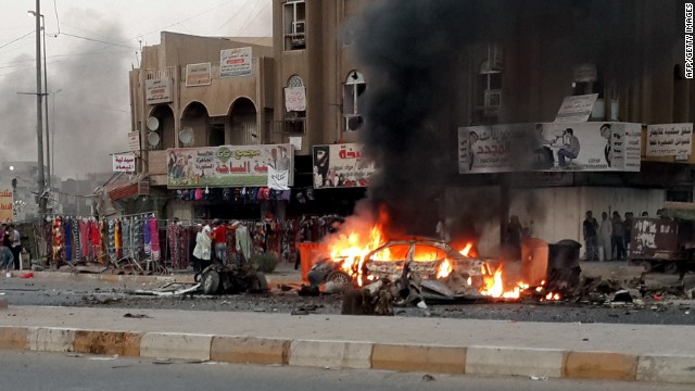 Flames rise from a vehicle at the site of a car bomb in Talibiya in Baghdad on September 3, 2013. More than 7,000 civilians and 950 security forces have been killed in violence in Iraq since January, according to the U.N. -- the highest annual toll since 2008.