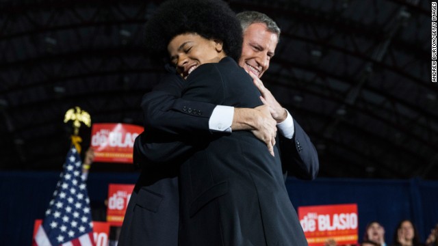 De Blasio hugs Dante at his election night party. De Blasio's family appeared frequently in his campaign ads, Dante saying in one,
"Bill de Blasio will be a mayor for every New Yorker, no matter where they live or what they look like. And I'd say that even if he weren't my dad."