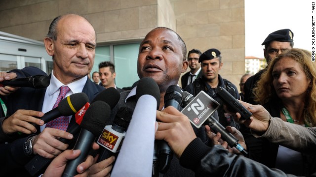 Patrick Lumumba, the Congolese bartender Knox originally accused of Kercher's murder, talks to the press outside the courthouse during a break form the appeal trial of Knox and Sollecito on September 30.