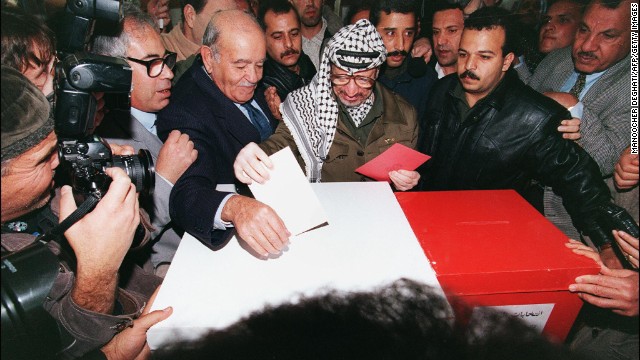 Arafat casts his ballot in Gaza City on January 20, 1996. Palestinians were voting for the first time in their history to select a president and 88-member council, and Arafat was elected president of the Palestinian National Authority.