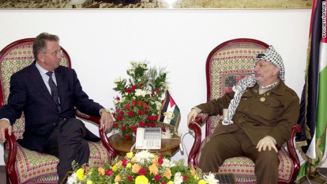 Arafat meets with United Nations Mideast envoy Terje Roed-Larsen in Gaza City on October 17, 2001. Arafat agreed to a cease-fire that would end several weeks of fighting between the Palestinian and Israeli armies.