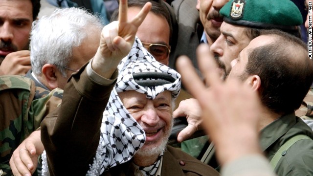 Arafat greets supporters in Ramallah on May 2, 2002, after Israeli soldiers withdrew from his compound late the previous night.