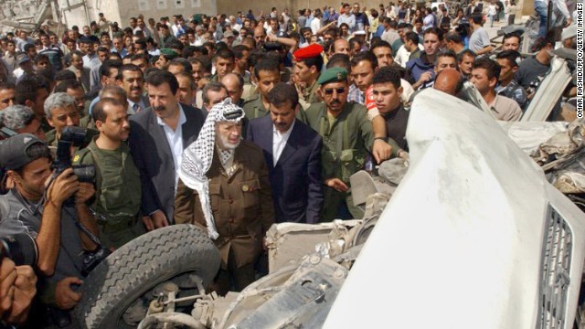 Arafat tours damage at his compound after it was attacked by Israeli troops on June 6, 2002 -- this time in retaliation for a suicide bombing that killed 17 Israelis, 13 of them soldiers.