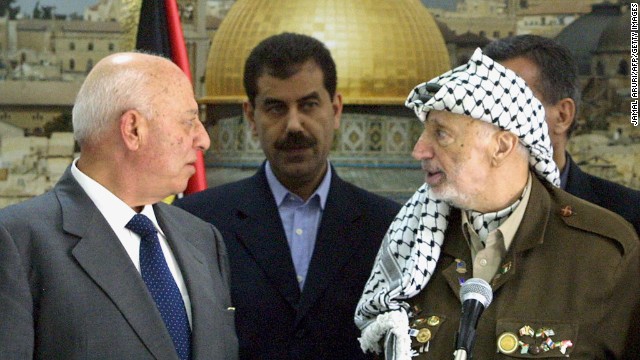 A state of emergency was declared in the Palestinian territories on October 5, 2003. Two days later, Palestinian Prime Minister Ahmed Qorei, left, and Arafat attend a swearing-in ceremony for the emergency Cabinet that was appointed.