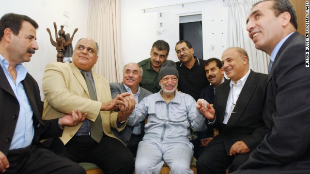 Arafat sits with aides and medical staff in Ramallah on October 28, 2004. The Palestinian leader's health was deteriorating, and he later sought medical treatment in Paris.