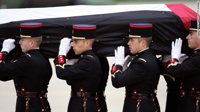 French Republican Guards transport Arafat's body to a military airport on November 11, 2004. Arafat died in a Paris hospital that day at the age of 75. The cause of his death has been disputed.