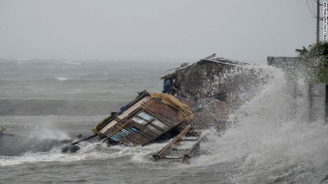 A house in Legazpi, Philippines, is engulfed by storm surge November 8.