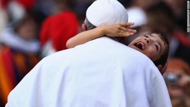 Francis embraces a young boy with cerebral palsy on March 31, 2013, a gesture that many took as a heartwarming token of his self-stated desire to "be close to the people."