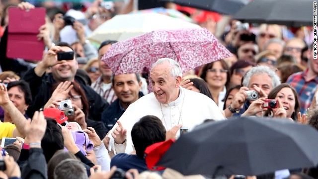 Pope Francis braves the rain to bless pilgrims in St. Peter's Square on May 29. 