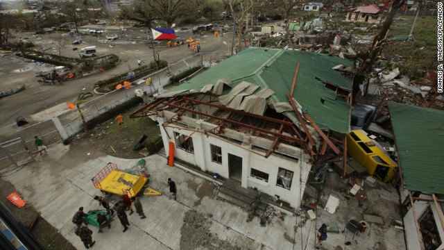 An airport lies in ruins in the city of Tacloban in the Philippines on Saturday, November 9. The most powerful cyclone in three decades battered the Philippines, killing a number of people and leaving more than 100 bodies scattered on the streets of this coastal city. Haiyan, one of the most intense typhoons on record, plowed across the country on Friday, with monster winds tearing roofs off buildings and giant waves washing away homes.