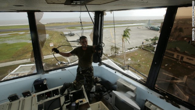 A soldier pulls a cable inside the devastated airport tower in Tacloban. 
