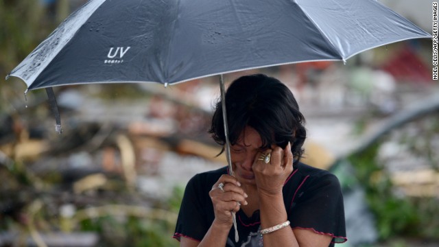 A woman mourns in front of her husband's dead body November 10 in Tacloban.