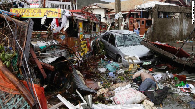 A body lies amid the devastation in Tacloban.