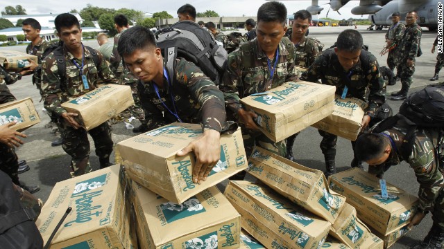 Philippine troops load boxes of water at Villamor Air Force Base in Manila on November 11.