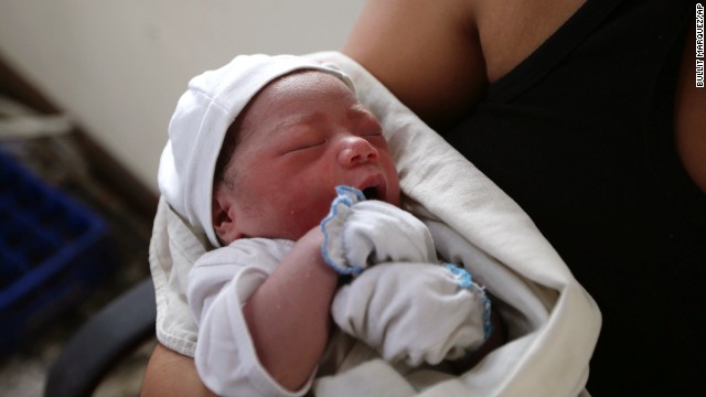 Newborn Bea Joy rests November 11 after her mother gave birth to her at the airport in Tacloban.