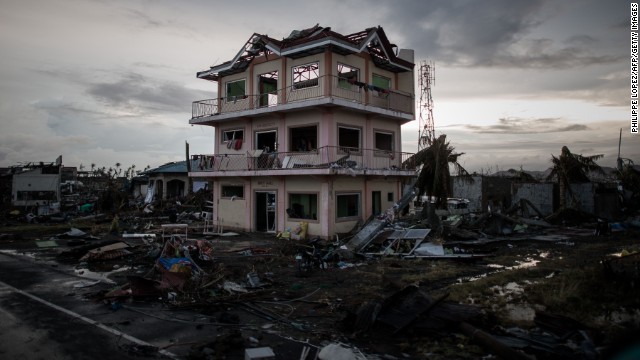 Debris lays scattered around a damaged home near the Tacloban airport on November 12.