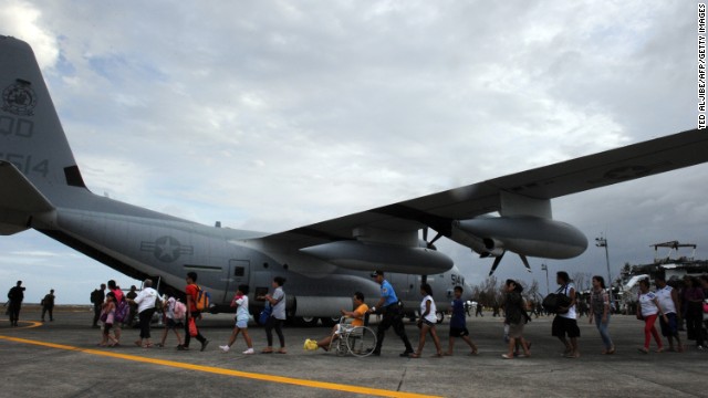 Typhoon survivors in Tacloban, Philippines, board a U.S. plane bound for the capital of Manila on November 11.