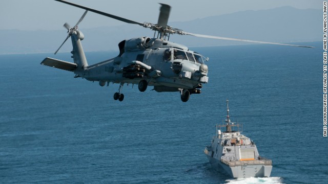 An MH-60R Seahawk flies near in the Pacific Ocean in February.