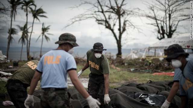 Bodies are unloaded at a makeshift morgue in Tacloban on November 12.