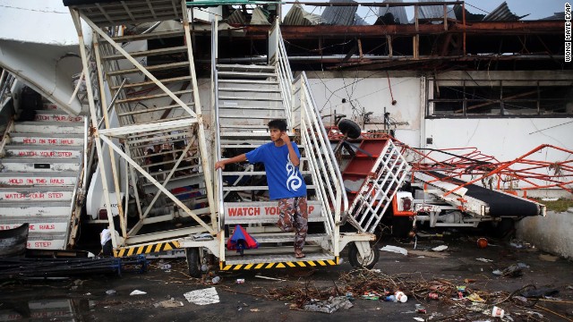 A young man waits at the airport November 12 in hopes of being evacuated from Tacloban.