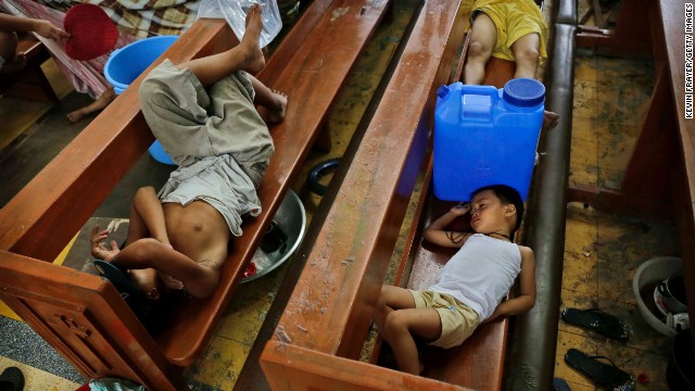 Residents take shelter in a Tacloban church on November 13 in the aftermath of Typhoon Haiyan.