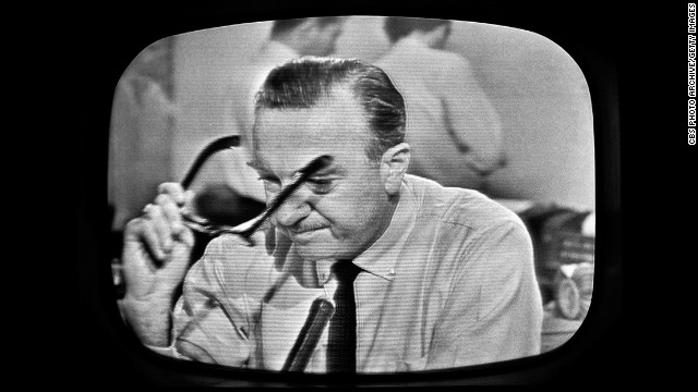 American broadcast journalist and anchorman Walter Cronkite removes his glasses and prepares to announce Kennedy's death. CBS broadcast the first nationwide TV news bulletin reporting on the shooting.