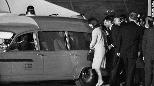 Jacqueline and Robert Kennedy get into the Navy ambulance with the president's body at Andrews Air Force Base, just outside Washington. The body of the president is taken to Bethesda Naval Hospital for an immediate autopsy. 