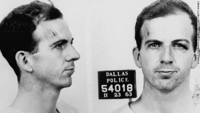 Police mug shot of Lee Harvey Oswald. He is arraigned in the slaying of Officer Tippit on November 22 and/or the murder of the president the next day. As Oswald is being transferred from the Dallas city jail to the county jail, nightclub owner Jack Ruby shoots and kills him, an event captured live on TV. Ruby is arrested immediately.