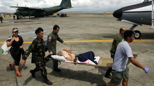 Soldiers transport a sick survivor November 13 in Tacloban.