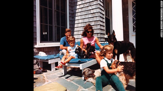 President Kennedy, John F. Kennedy Jr., Jackie and Caroline with puppies Blackie and White Tips, and family dogs Shannon, Clipper, Wolfie and Charlie on August 14, 1963. 