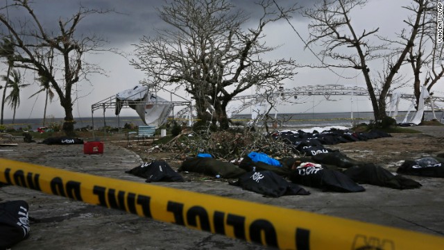 Dozens of bodies are placed near Tacloban City Hall on November 14 as workers prepare a mass grave on the outskirts of the hard-hit city.