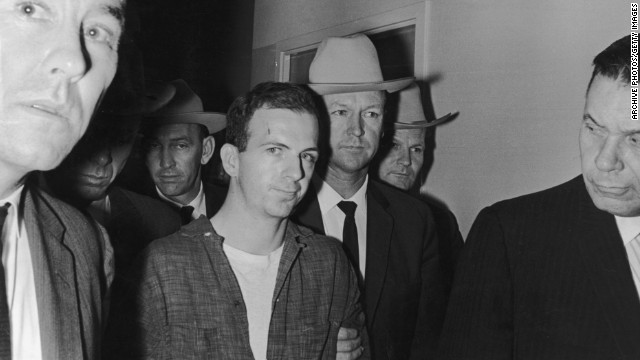 Lee Harvey Oswald, a 24-year-old ex-Marine, is arrested in the back of a movie theater where he fled after shooting Dallas Police Patrolman J.D. Tippit. That incident occurred approximately 45 minutes after the assassination. 