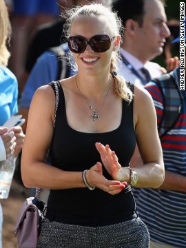 Wozniacki was all smiles as she followed McIlroy round the course. She is in Dubai beginning her preparations for the new tennis season. Her appearance confounded stories that the pair were no longer an item.