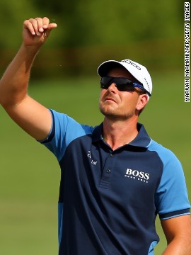 Henrik Stenson checks the wind during his opening round of four-under. He is the favorite to claim the Race to Dubai crown after a stellar season, which also saw him take the PGA Tour's FedEx Cup. If he were to win the European Tour's season finale he'd be the first golfer ever to do the double.