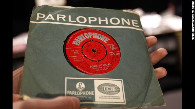 The Beatles released their first album, "Please Please Me," in the United Kingdom on March 22, 1963. A 7-inch copy of the single, seen here, was signed on both sides by the Fab Four and sold in 2011 for more than £9,000.