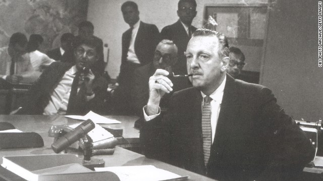 Walter Cronkite sits behind the news desk on the set of the "CBS Evening News with Walter Cronkite," New York in August 1963. Cronkite became the anchor of American network television's first nightly half-hour news program on September 2, 1963.