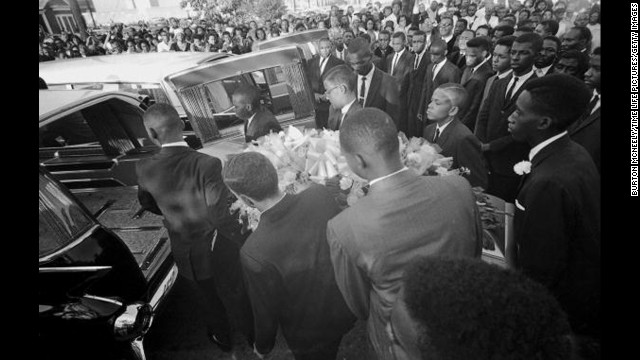 A coffin is loaded into a hearse at a funeral for victims of the 16th Street Baptist Church bombing. The Birmingham Church Bombing, also known as "Bloody Sunday," took place on September 15, 1963.