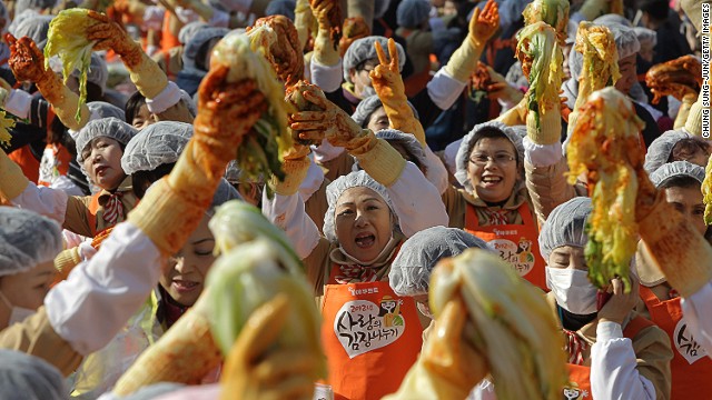 If you thought one Korean ajumma (older Korean woman with a curly perm and a 'tude) was scary, try 3,000 in one place. Just kidding. These housewives are Seoul's warmest-hearted -- they gathered on Wednesday to make kimchi for poor households who can't make their own. 