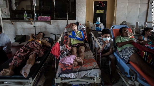 Typhoon victims are treated in the lobby of a Tacloban hospital on November 15.