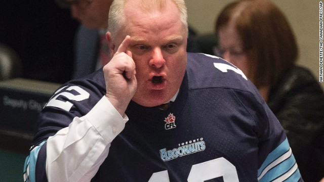 Toronto Mayor Rob Ford reacts to City Council members on Thursday, November 14, after former aides told police they had concerns about his drug use and drunken driving. Toronto's City Council voted Friday to strip Ford of his ability to govern in case of an emergency and to appoint and dismiss his senior staff, unprecedented moves aimed at reining him in.